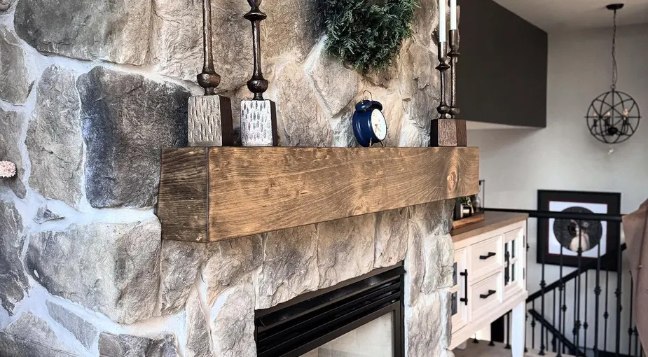 Manufactured stone veneer fireplace with consistent stone profiles