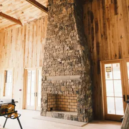 Floor-to-Ceiling Rustic Stone Fireplace, photo 1