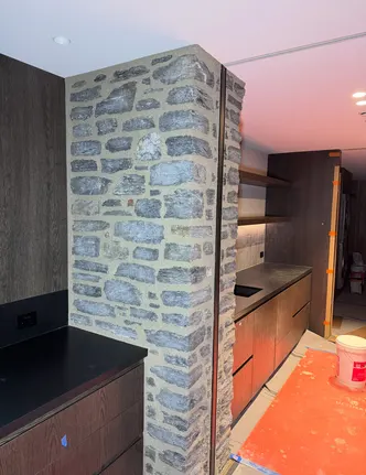 Interior Stone Veneer Columns in an Open Kitchen