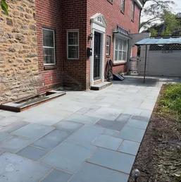 Rectangular Bluestone Patio Beside a Brick Home, photo 1