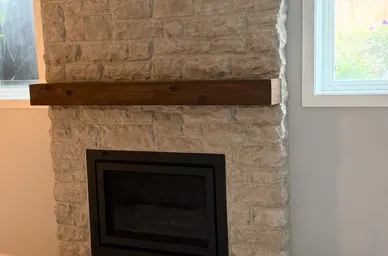Stacked Stone Fireplace with Timber Mantel detail