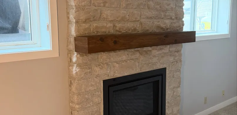 Stacked Stone Fireplace with Timber Mantel