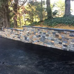 Stacked Stone Retaining Wall Along a Driveway, photo 2