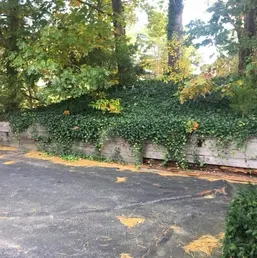 Stacked Stone Retaining Wall Along a Driveway, photo 3