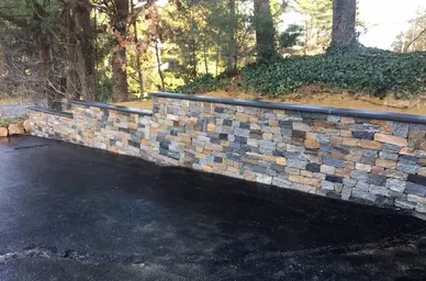 Stacked Stone Retaining Wall Along a Driveway detail