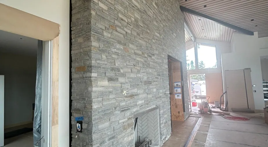 Stacked stone veneer panels on an interior wall